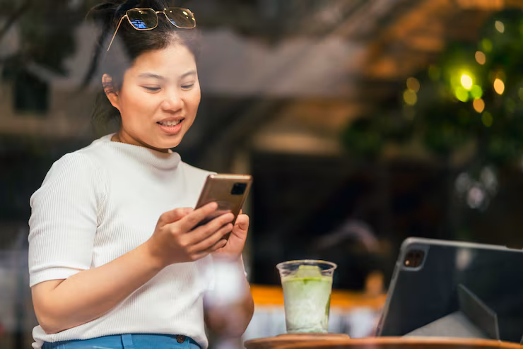 smart-attractive-positive-asian-digital-nomad-female-wearing-casual-cloth-work-remote-new-normal-lifestyle-hand-use-tablet-tele-conference-onlive-videocall-meeting-remote-coffeeshop-cafe_609648-2908