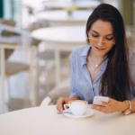 young-lady-drinking-tea-cafe_1303-10725